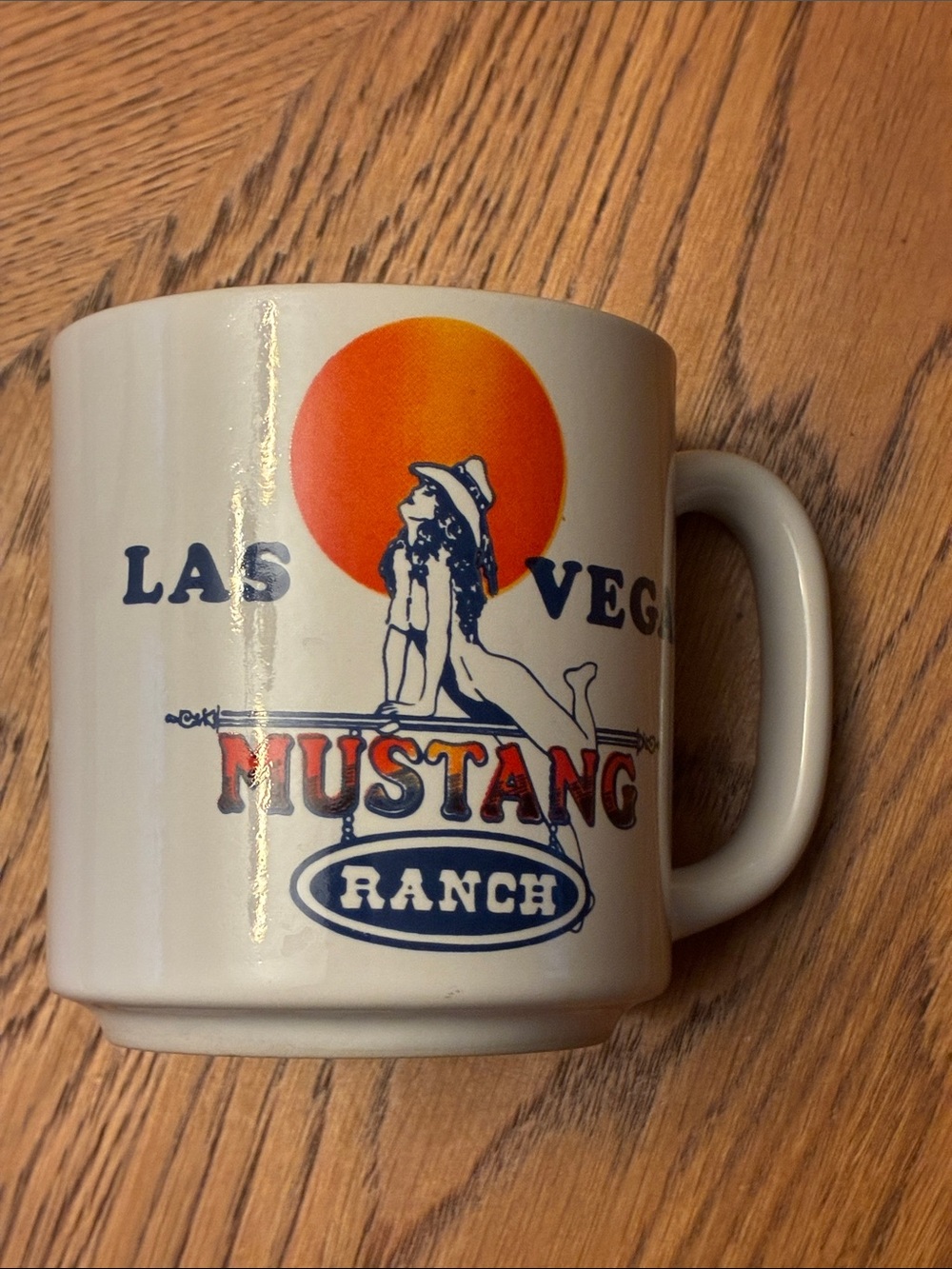 Mustang Ranch Las Vegas White Ceramic Coffee Mug with Orange Sun Graphic